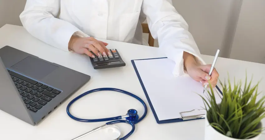 Image of a person calculating out-of-pocket healthcare costs