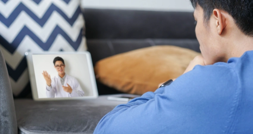 Image of a person choosing a telehealth program for dual diagnosis disorder treatment