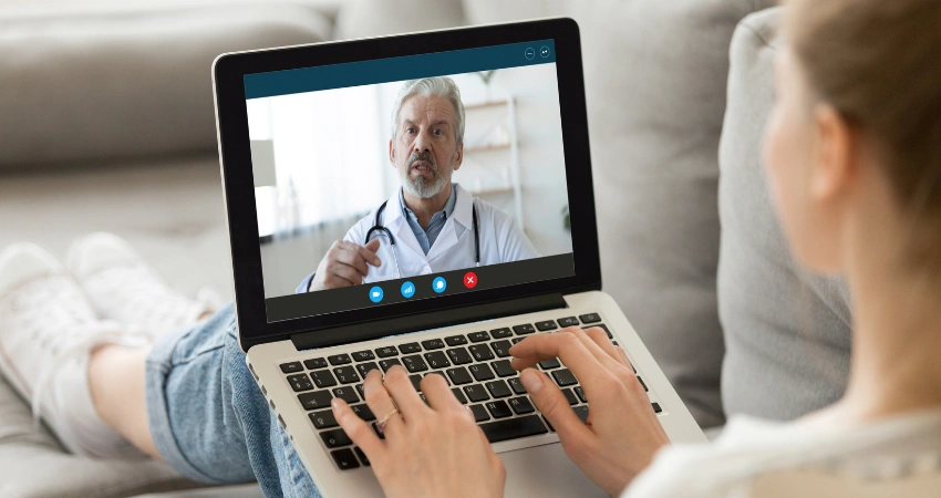 Image of a professional privately attending a virtual IOP therapy session from the comfort of home