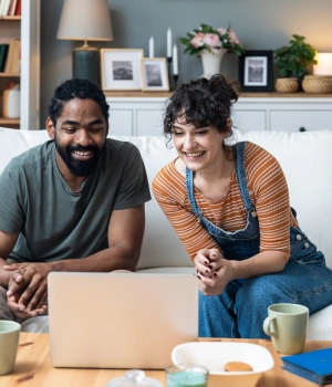 Image of a couple comfortably participating in a virtual therapy session from home