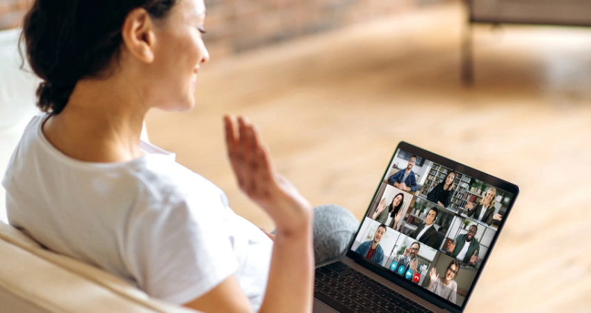 Image of a woman attending a virtual IOP session flexibly from any location using her laptop