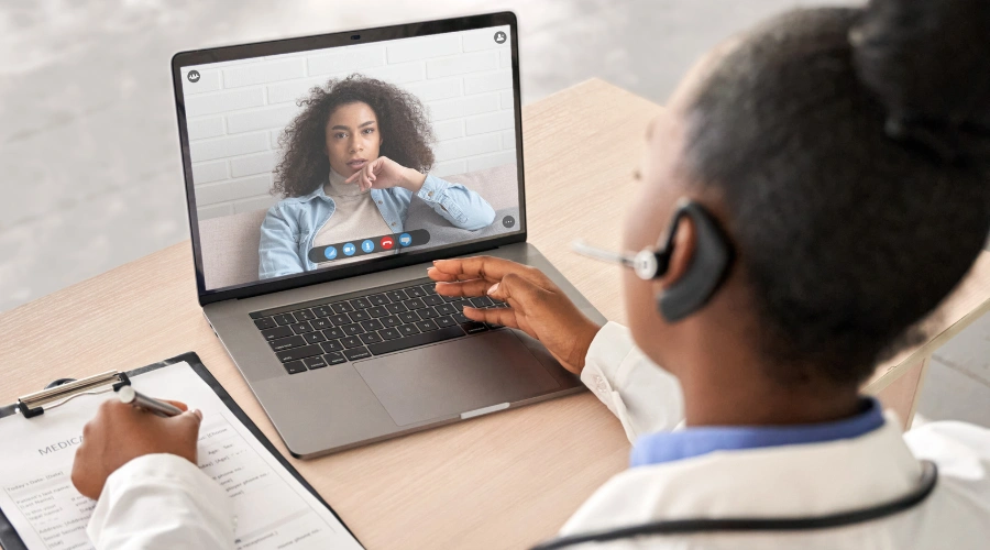 Image of a doctor taking a patient intake during virtual session
