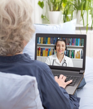 Image of a psychiatrist and patient in a telehealth consultation discussing medication-assisted treatment options
