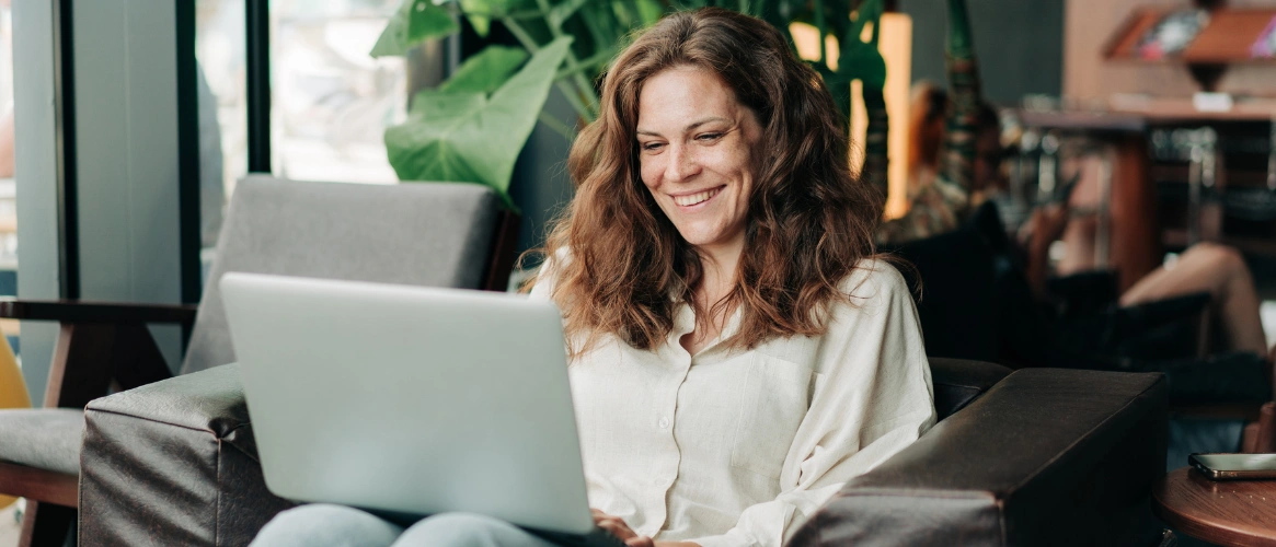 Image of a woman on her laptop in a private, secure space meeting the technology requirements for virtual therapy sessions