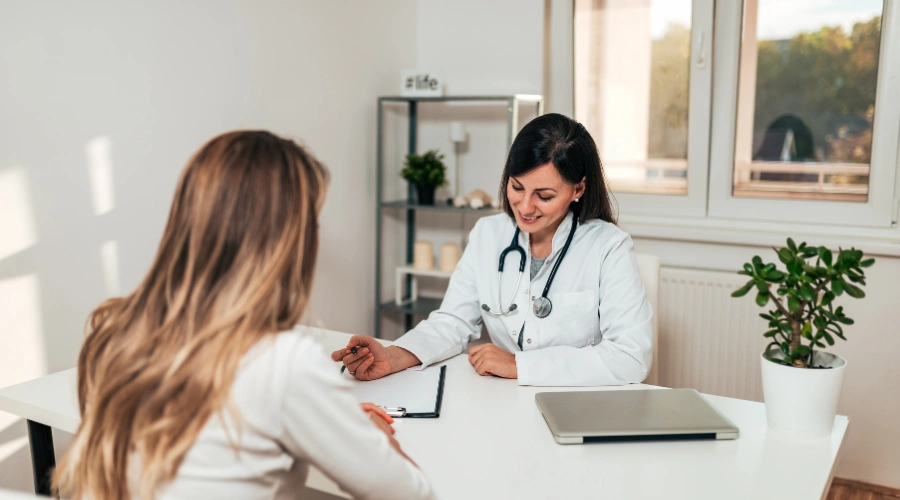 Image of a patient at a pharmacy discussing medication-assisted treatment and local medical care access