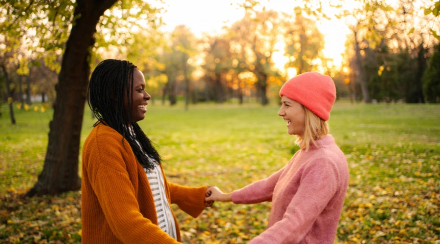 Image of a person having a supportive conversation with a friend outdoors as a positive alternative