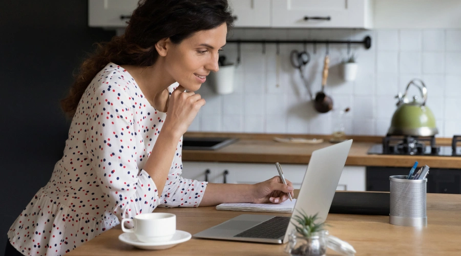 Image of a woman balancing daily home responsibilities and structured virtual IOP treatment after residential care