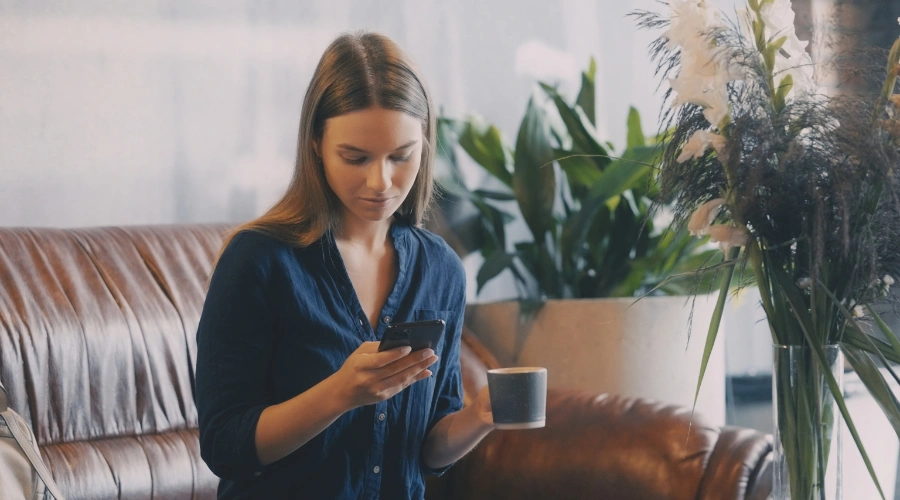 Image of a woman on the phone coordinating a smooth handoff between her residential discharge team and new virtual IOP provider